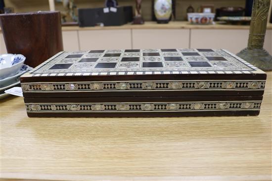 An Indian mother of pearl and bone chess/backgammon games box with horn and bone counters width 42cm depth 21cm